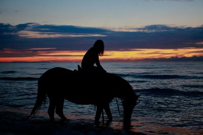 Scenic view of sea at sunset