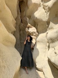 Woman standing on rock