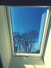 Low angle view of glass window of building