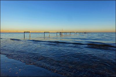 Scenic view of sea against clear blue sky