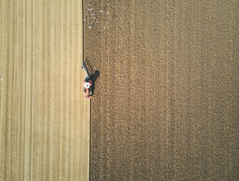High angle view of woman walking on sand