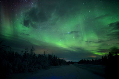 Scenic view of road against sky at night