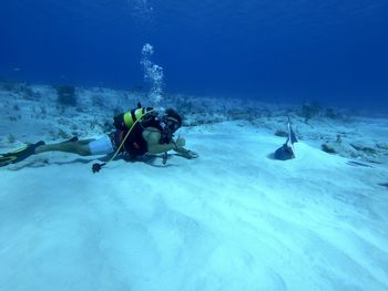 People swimming in sea