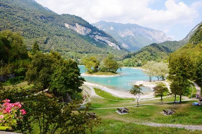 Scenic view of lake and mountains against sky