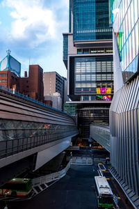 Street amidst buildings in city against sky