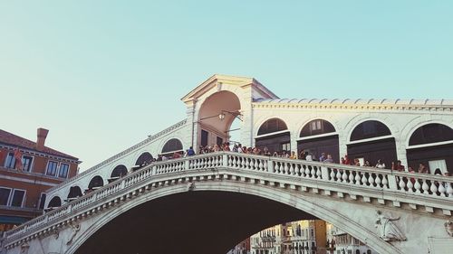 Low angle view of arch bridge against clear sky