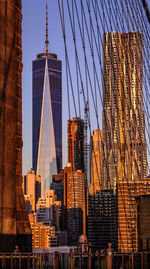 Low angle view of skyscrapers in city against sky