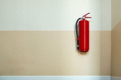 Close up of fire extinguisher on wall