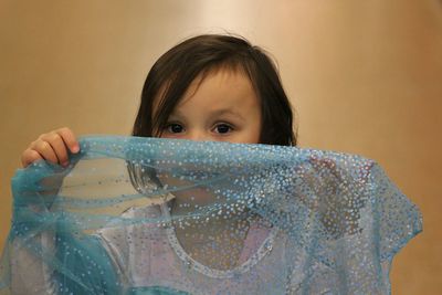 Portrait of cute girl playing at home