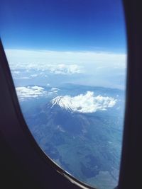 Scenic view of mountains seen through airplane window