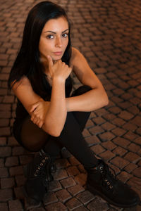 Portrait of woman sitting outdoors