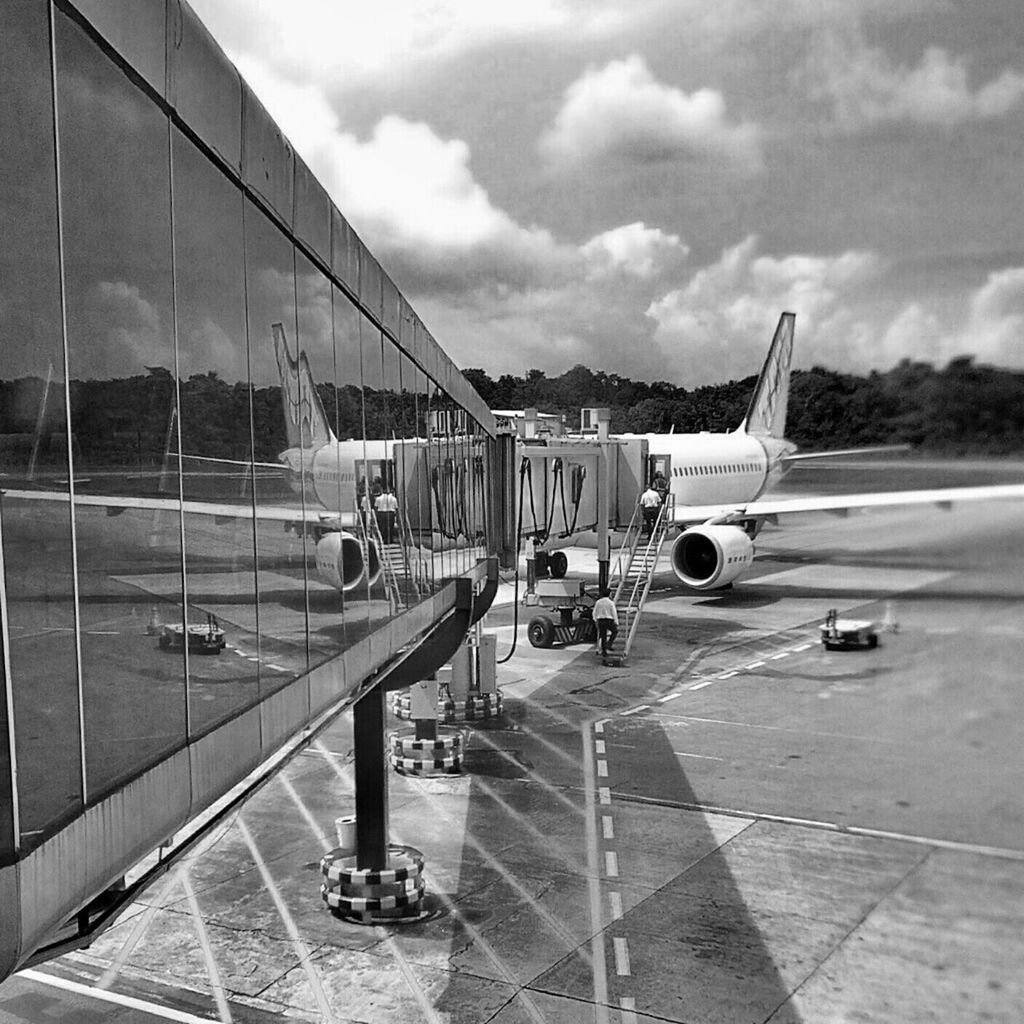 transportation, sky, mode of transport, cloud - sky, road, land vehicle, road marking, cloudy, built structure, travel, cloud, architecture, the way forward, car, on the move, airport, day, journey, outdoors, incidental people