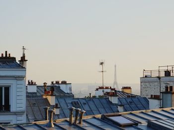 Buildings against clear sky during sunset