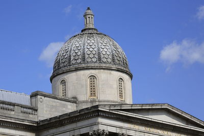 Low angle view of building against blue sky