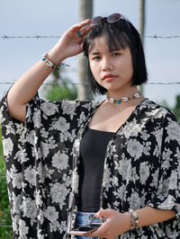 Portrait of young woman looking at camera