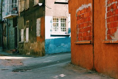 Empty alley amidst buildings