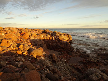 Scenic view of sea against sky at sunset