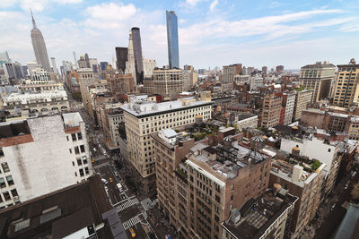 Aerial view of cityscape against sky