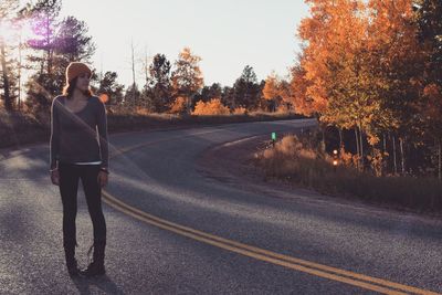 Woman standing on road