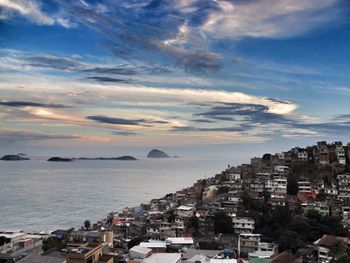 High angle view of city against cloudy sky