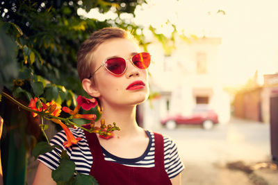 Portrait of young woman in sunglasses