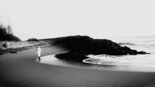 Scenic view of beach against clear sky