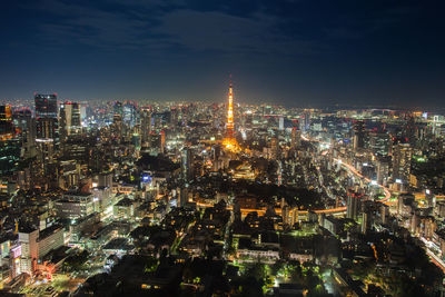 High angle view of illuminated city buildings at night