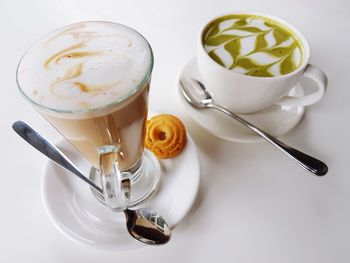 High angle view of coffee cup over white background