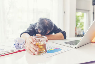 Man using laptop on table