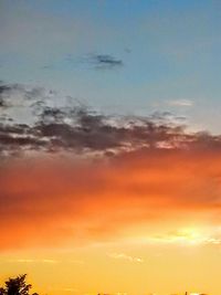 Low angle view of cloudy sky at sunset