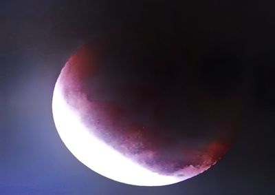 Low angle view of moon against sky at night