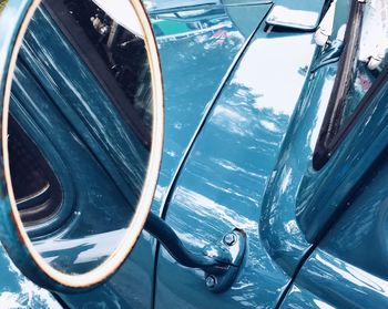 Close-up of side-view mirror on car