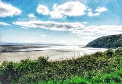 Scenic view of beach against sky