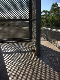 Shadow of railing on tree