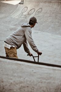 Full length of boy skateboarding on skateboard