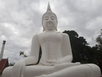 Low angle view of statue against sky