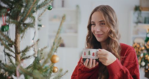 Portrait of young woman using mobile phone