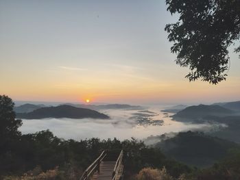 Scenic view of silhouette mountains against sky during sunset