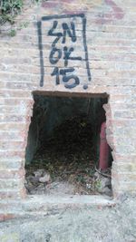 Full length of woman standing on wall