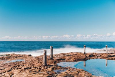 Scenic view of sea against blue sky