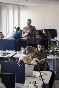 Two professionals discussing in office