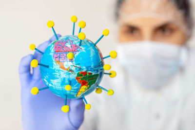 Close-up portrait of woman holding umbrella