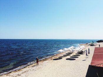 View of sea against clear blue sky