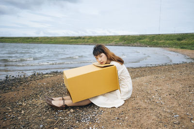 Woman sitting on beach
