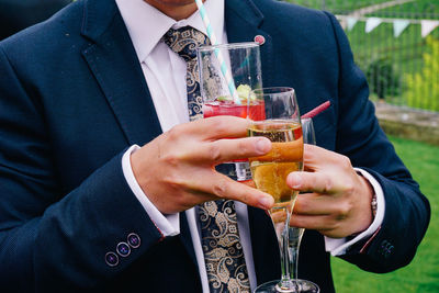 Close-up of man holding drink