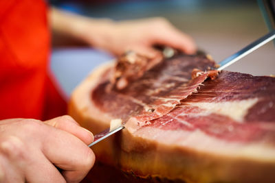 Close-up of man preparing food