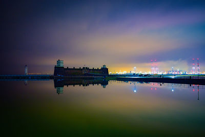 Scenic view of river against sky at night