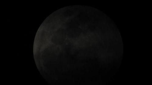 Moon in dark sky