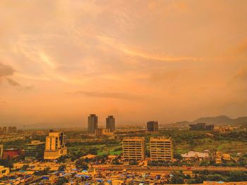 High angle view of buildings against sky during sunset