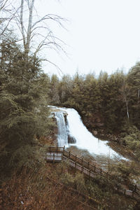 Scenic view of waterfall against clear sky